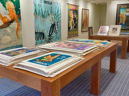 Vintage posters cover walls and tables at Flying Cloud Fine Art Posters in Easton.