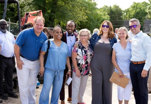 A group of people smiling at the camera.