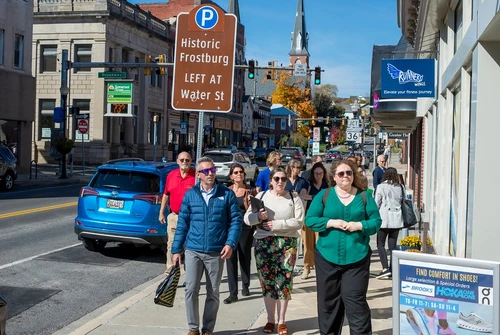 A group of people walking down the street.