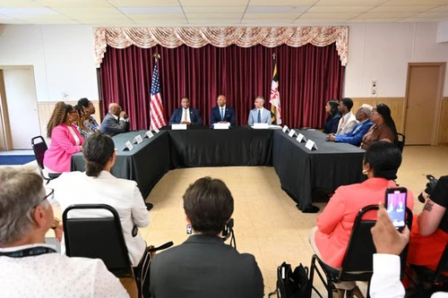 A group of people sitting at a table.