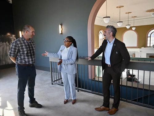 Secretary Jake Day and Takoma Park Mayor Talisha Searcy chat with Sangfroid Distilling owner.
