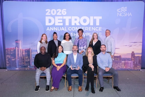 Maryland DHCD staff pose with award at 2026 National Council of State Housing Agencies conference