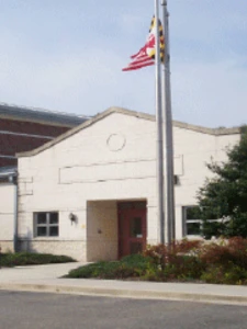 Main entrance of the Western Maryland Children's Center. White brick building attached to a red brick residential center.