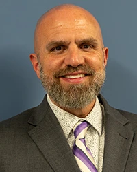 Headshot of Derek Getic.