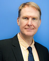 Headshot of John Irvine.