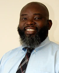 Headshot of Olusola Ogunranti.