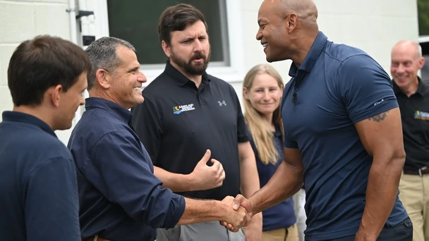 Governor Moore shaking hands with staff for the Department of Natural Resources