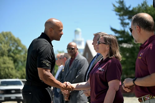 Governor Moore shaking hands
