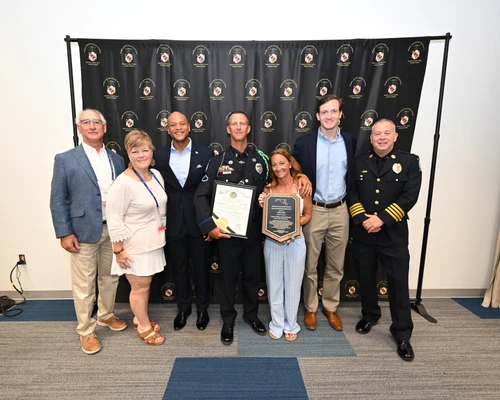 Governor Moore with "Top Cop" Senior Officer Richard "Rick" Krause and others
