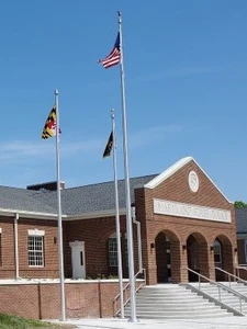 Maryland Department of State Police Cumberland barrack building with flags flowing