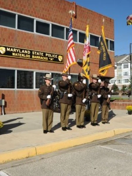 Maryland State Police Waterloo Barrack with state troopers standing in front of the building
