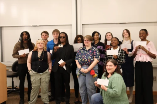 A group of students at the College of Southern Maryland posing after winning the PSA contest for the Maryland Vehicle Theft Prevention Council