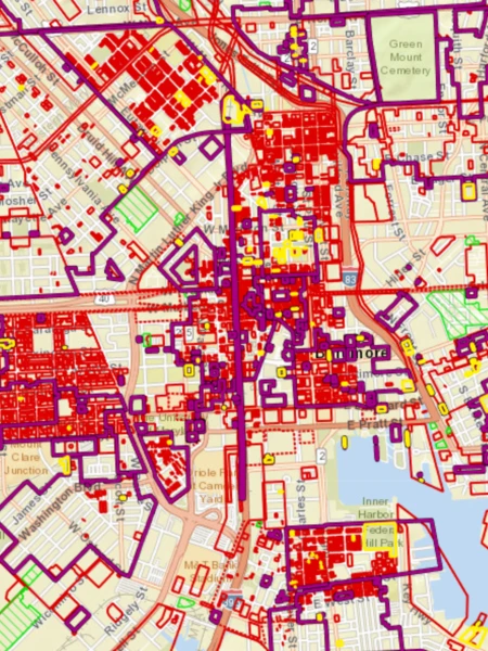 GIS map of Baltimore with colored shapes indicating various sites and districts.
