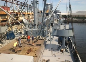 Workers conducting preservation on the JW Brown superstructure.