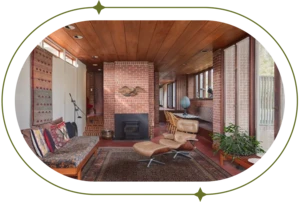 Mid-century furniture in wood paneled room.