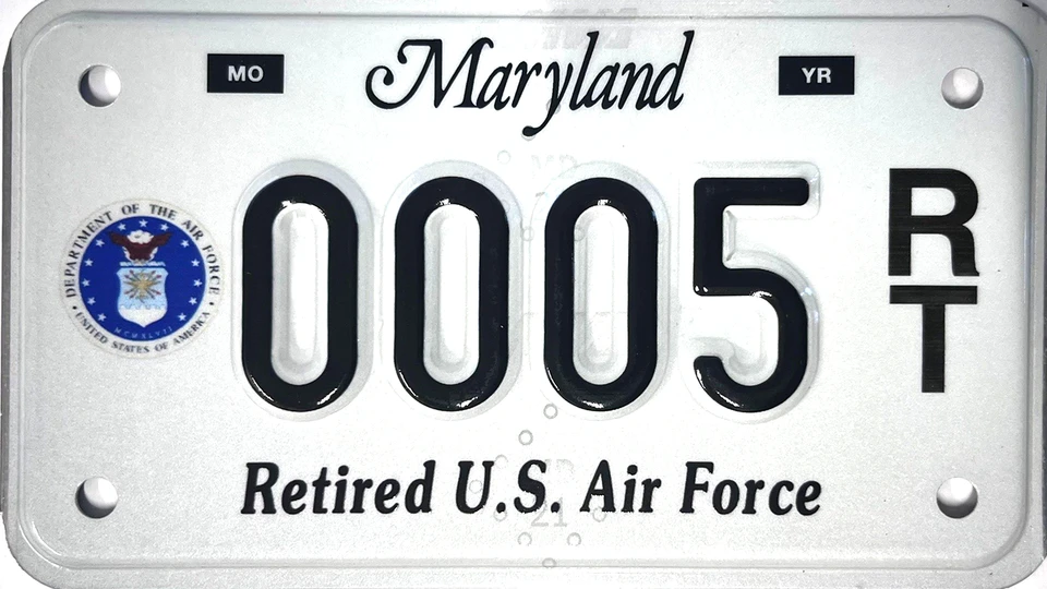 White license plate with the Air Force seal to the left of the plate number.