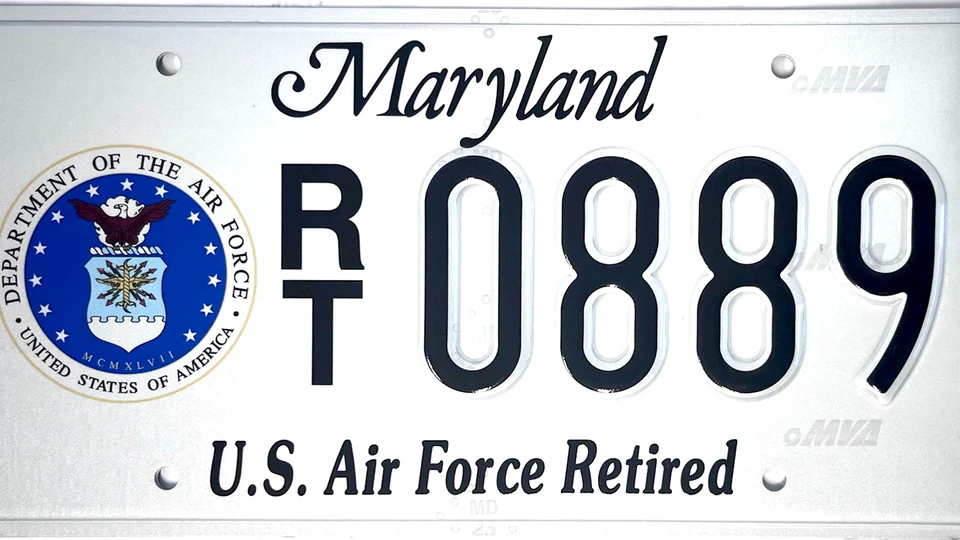White license plate with the Air Force seal to the left of the plate number.