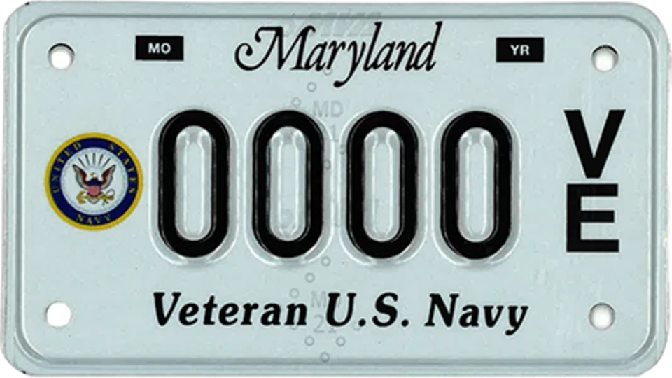 Light blue plate with the Navy seal to the left of the plate number.