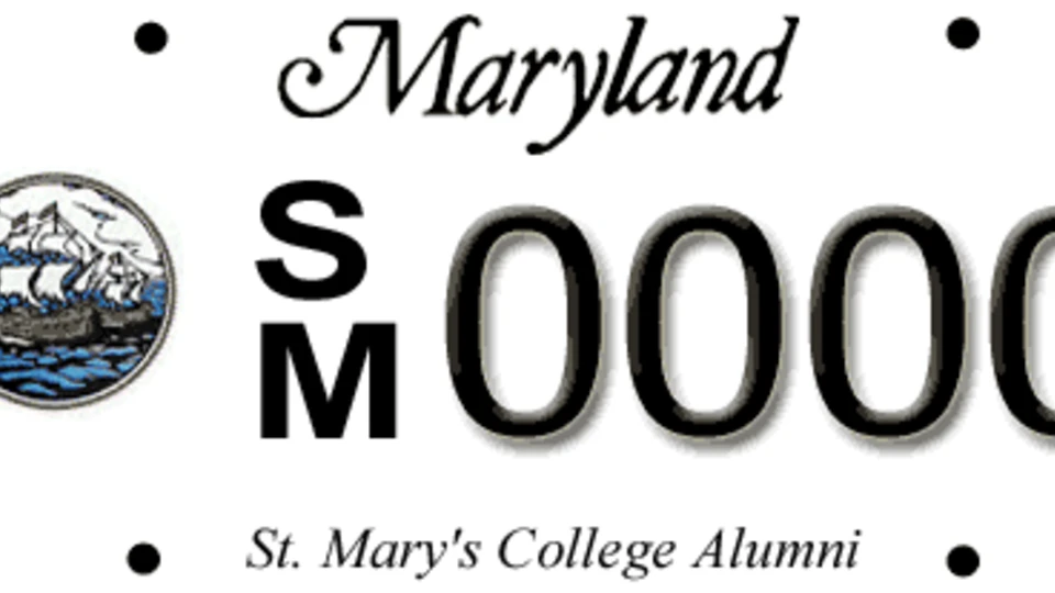 Maryland license plate featuring the St. Mary’s College Alumni logo, a sailing ship seal, and the letters SM followed by the number 0000.