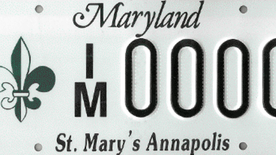 Maryland license plate with a fleur-de-lis logo and "St. Mary's Annapolis" printed at the bottom.