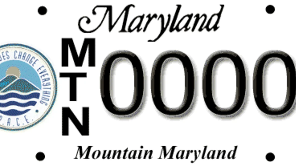 A Maryland license plate featuring the P.A.C.E. logo, the vertical text "MTN," a "0000" number, and the slogan "Mountain Maryland" at the bottom.