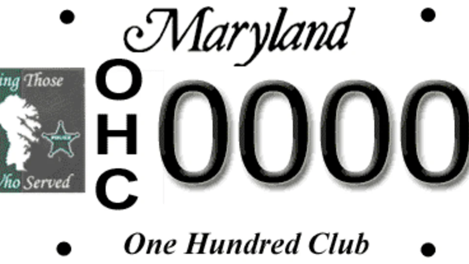 Maryland license plate for "The One Hundred Club" with "OHC" vertically, a logo for fire and police, and the text "Serving Those Who Served."