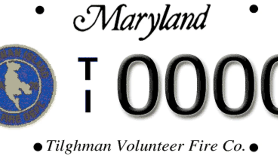 Maryland license plate with the Tilghman Volunteer Fire Co. logo on the left, "Maryland" at the top, and "T 0000" in the center.
