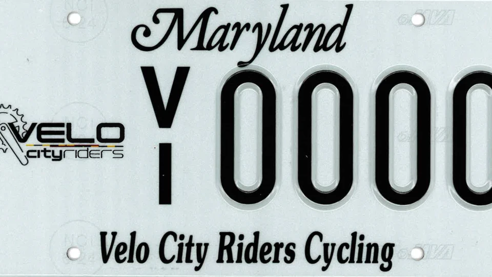 Maryland license plate with "VELO city riders" logo on the left, "Y0000" in the center, and "Velo City Riders Cycling" across the bottom.