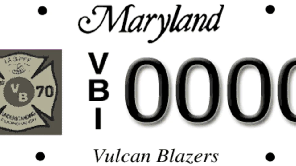 Maryland license plate with a "Vulcan Blazers" logo, featuring the text "Maryland," the letters "VB" stacked vertically, and the number "0000."