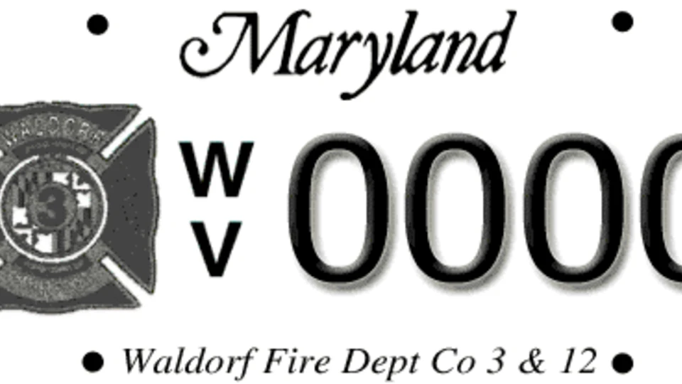 A Maryland license plate featuring the Waldorf Volunteer Fire Department Co 3 & 12 emblem and the letters WV followed by four zeros.