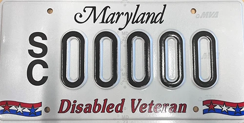 White license plate black Maryland text, black SC00000 plate number, patriotic red, white, blue stars and stripes, red Disabled Veteran text