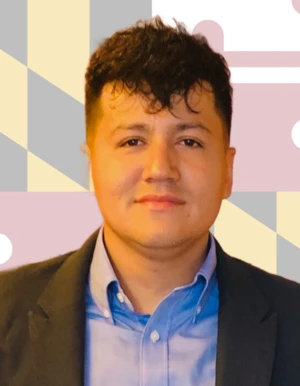 Man in a suit with a faded Maryland Flag Background