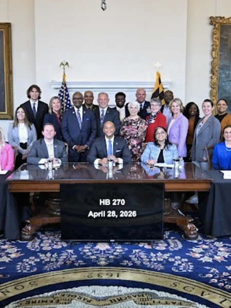 a group of people in the governor's room for a bill signing