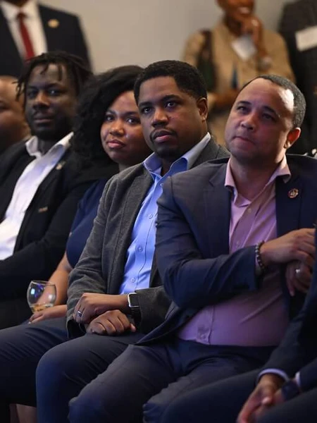 Audience members listening to Governor Moore during the Baltimore Corps Anniversary gathering