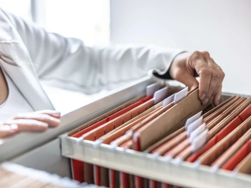 Close up of a filing cabinet with folders